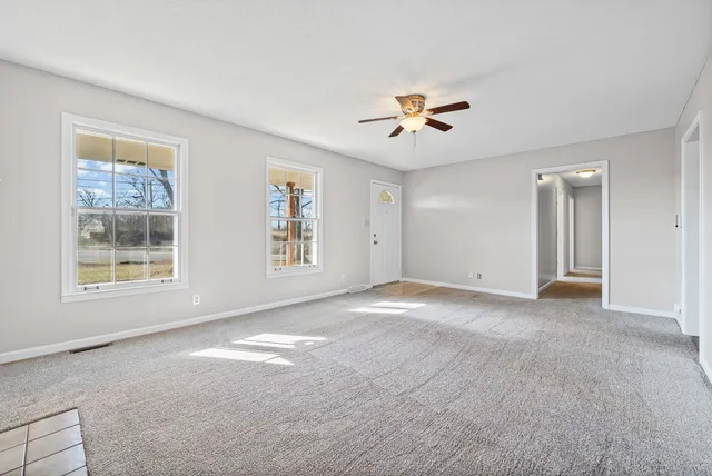 a view of an empty room with a window