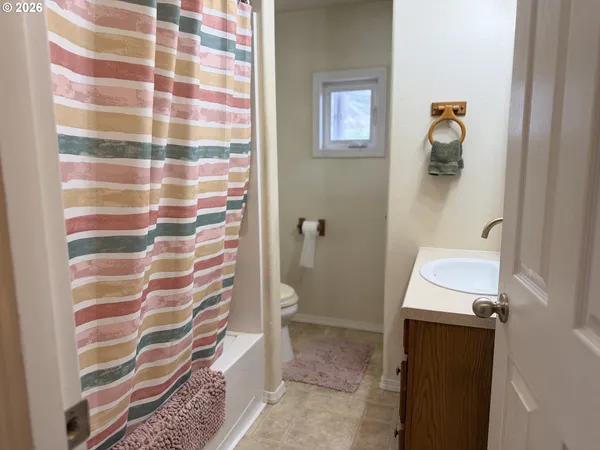a bathroom with a sink and a shower
