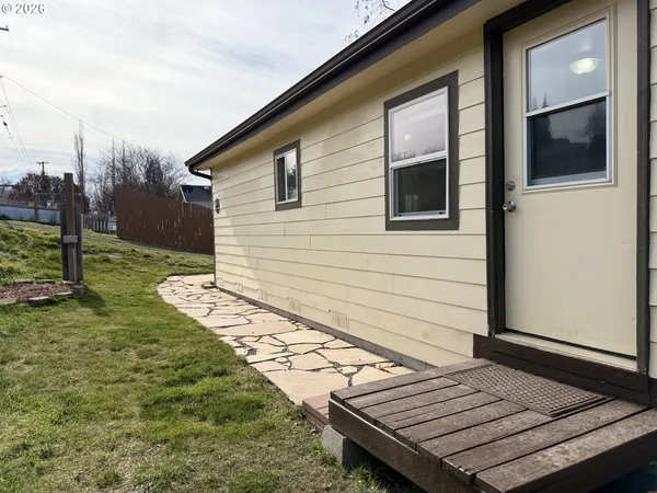a view of a backyard with sitting area