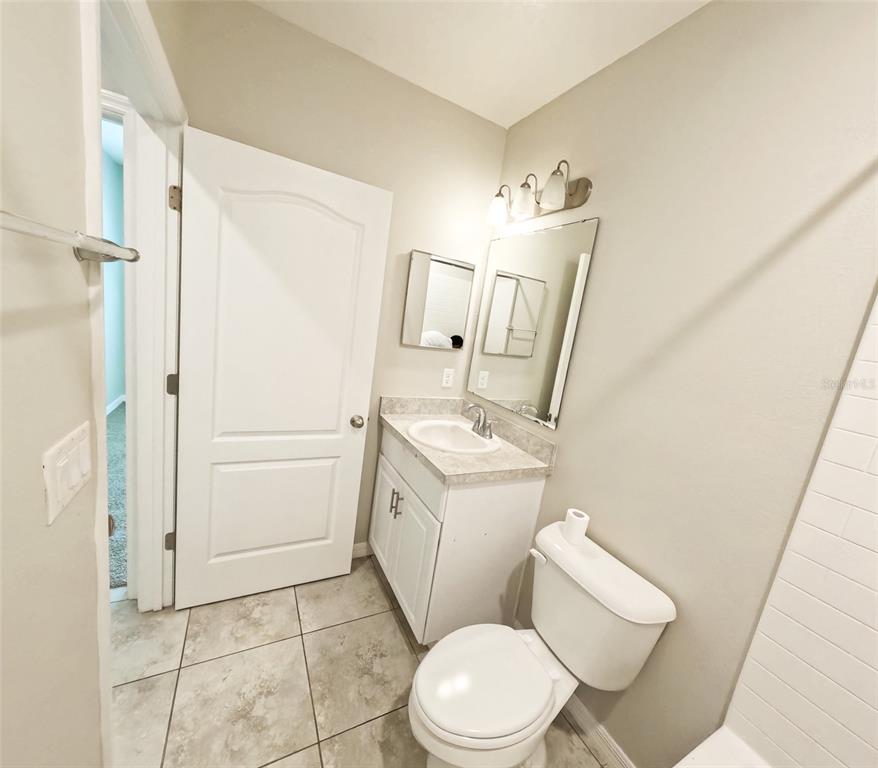 3381 Southwest 129th Loop Ocala, FL 34473 - Photo 15 of 35 a white toilet sitting next to a bathroom sink