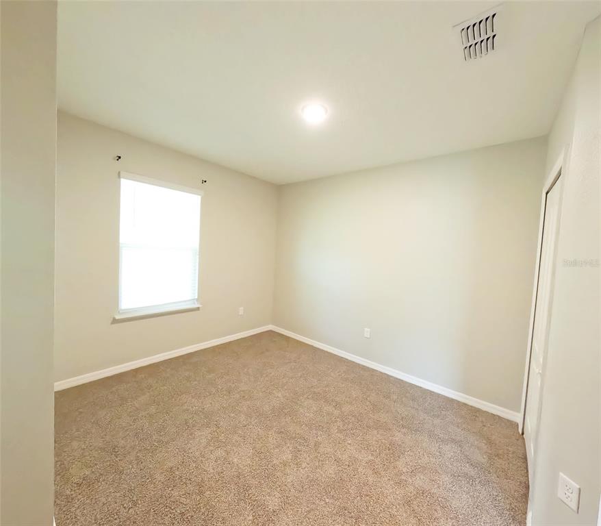 3381 Southwest 129th Loop Ocala, FL 34473 - Photo 16 of 35 an empty room with a window