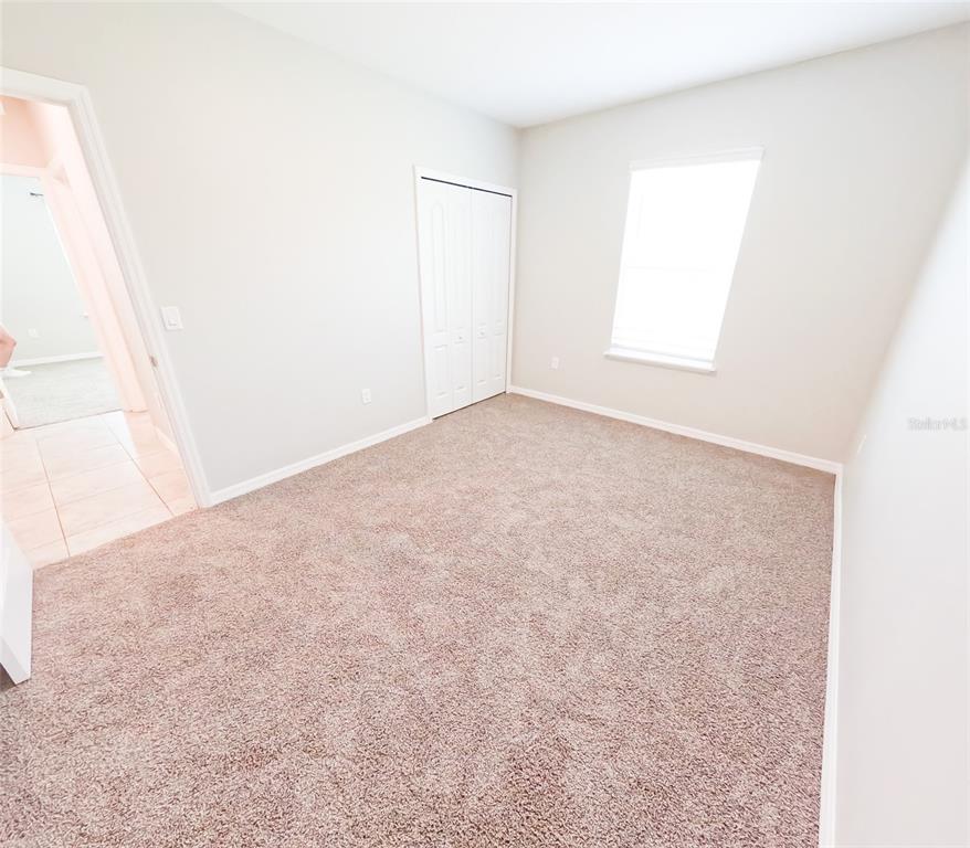 3381 Southwest 129th Loop Ocala, FL 34473 - Photo 19 of 35 an empty room with a window