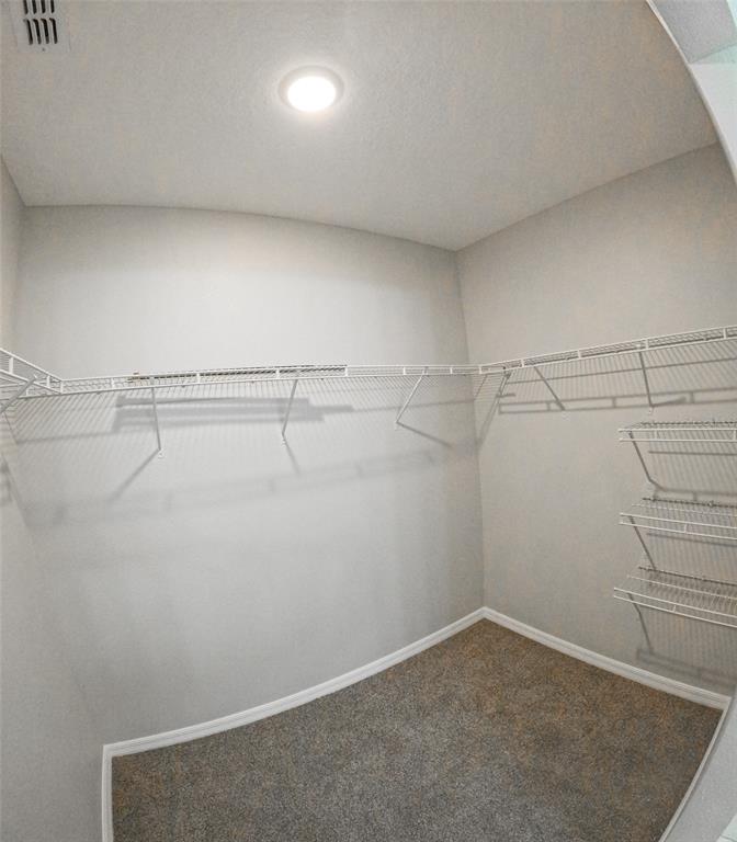 3381 Southwest 129th Loop Ocala, FL 34473 - Photo 22 of 35 a view of a room with racks on the wall