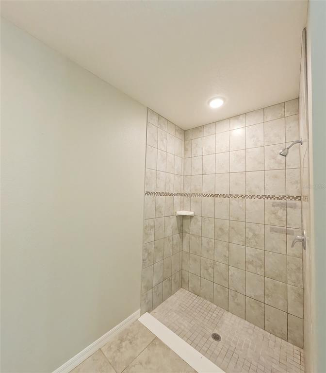 3381 Southwest 129th Loop Ocala, FL 34473 - Photo 24 of 35 a bathroom with a shower and a sink