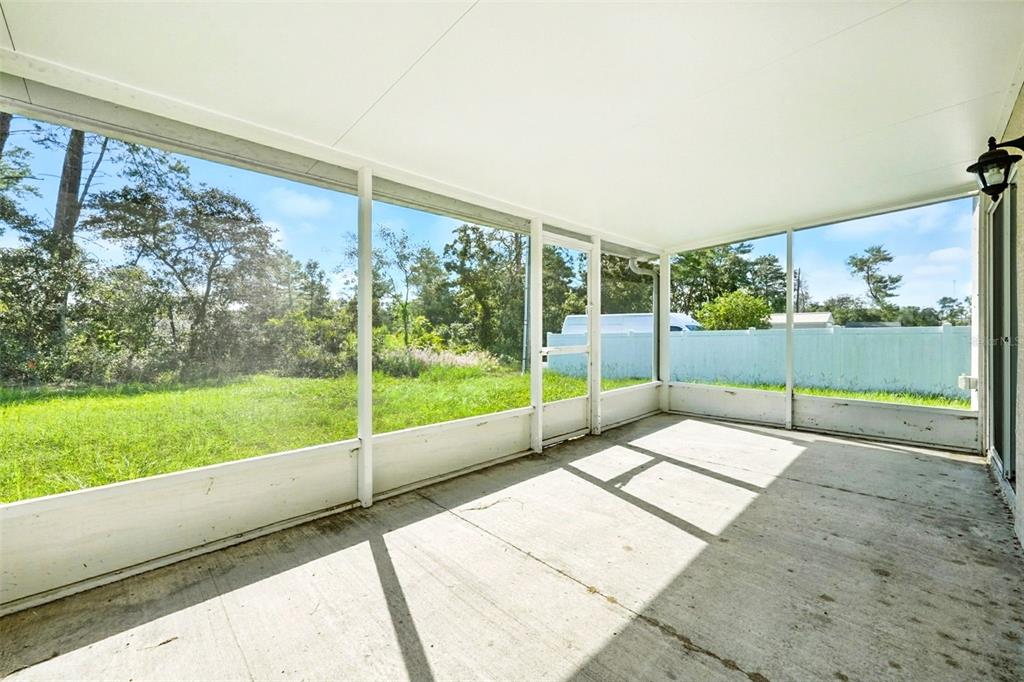 3381 Southwest 129th Loop Ocala, FL 34473 - Photo 26 of 35 a view of a garden with an outdoor seating