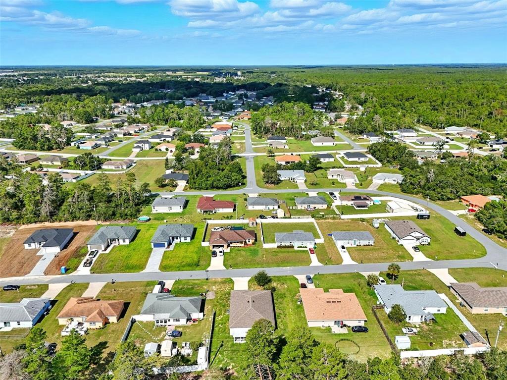 3381 Southwest 129th Loop Ocala, FL 34473 - Photo 35 of 35 an aerial view of residential houses with outdoor space