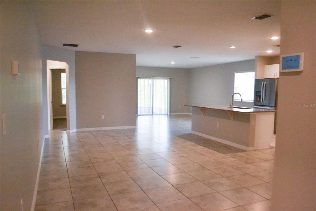 3381 Southwest 129th Loop Ocala, FL 34473 - Photo 8 of 35 a view of an empty room and kitchen view