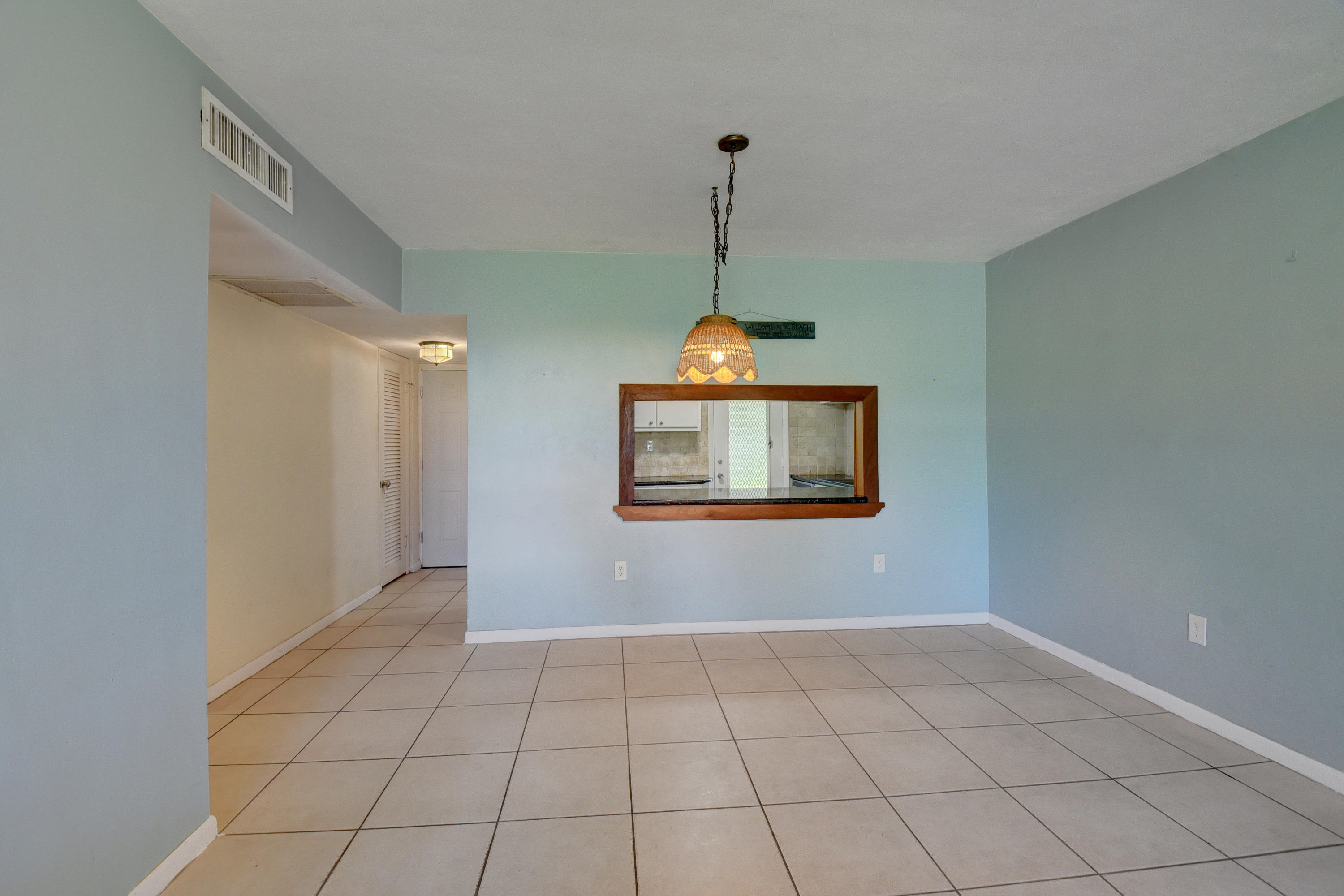 2700 Banyan Road, Unit 2C Boca Raton, FL 33432 - Photo 12 of 33 a view of an empty room with a window