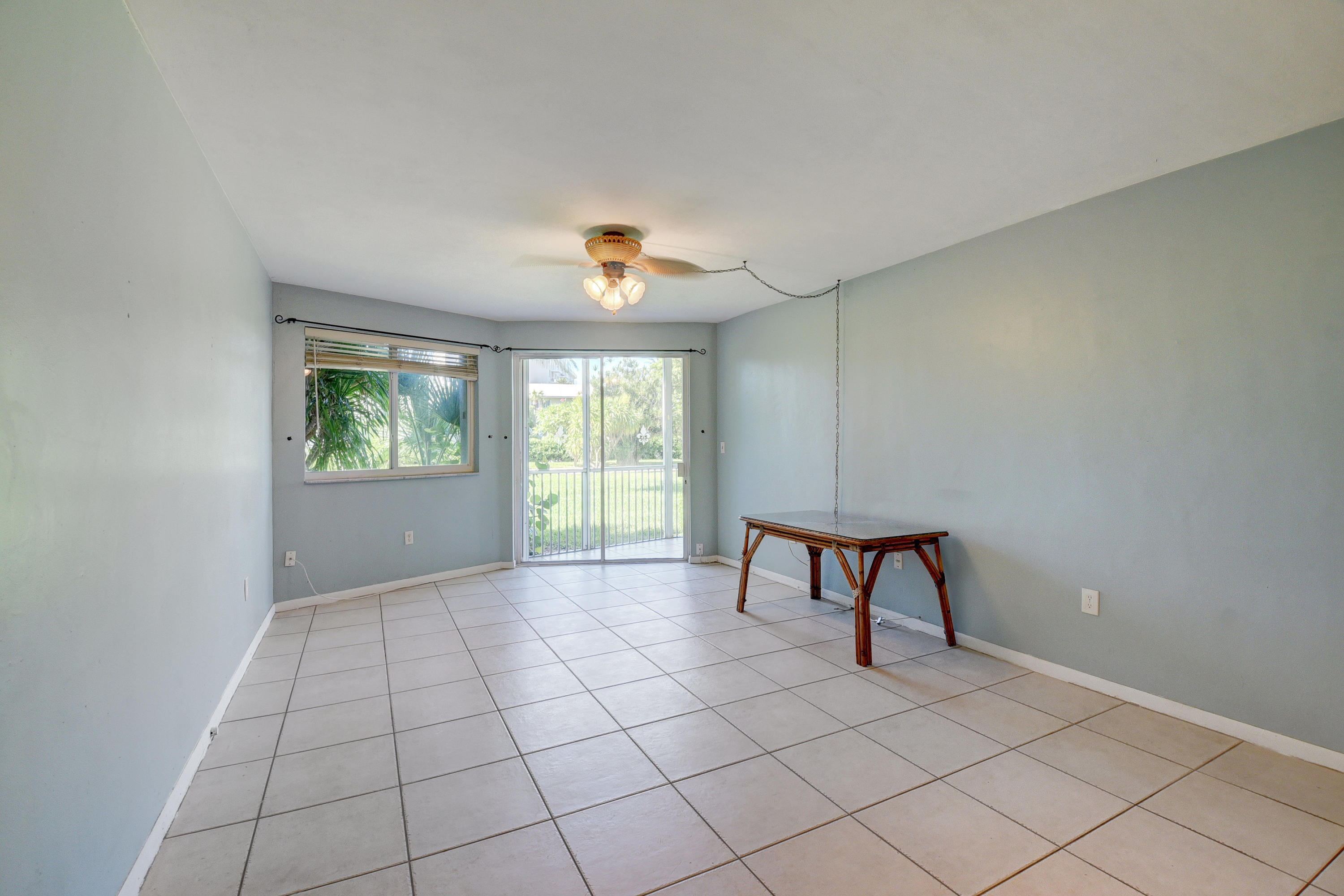2700 Banyan Road, Unit 2C Boca Raton, FL 33432 - Photo 14 of 33 a view of an empty room with a window
