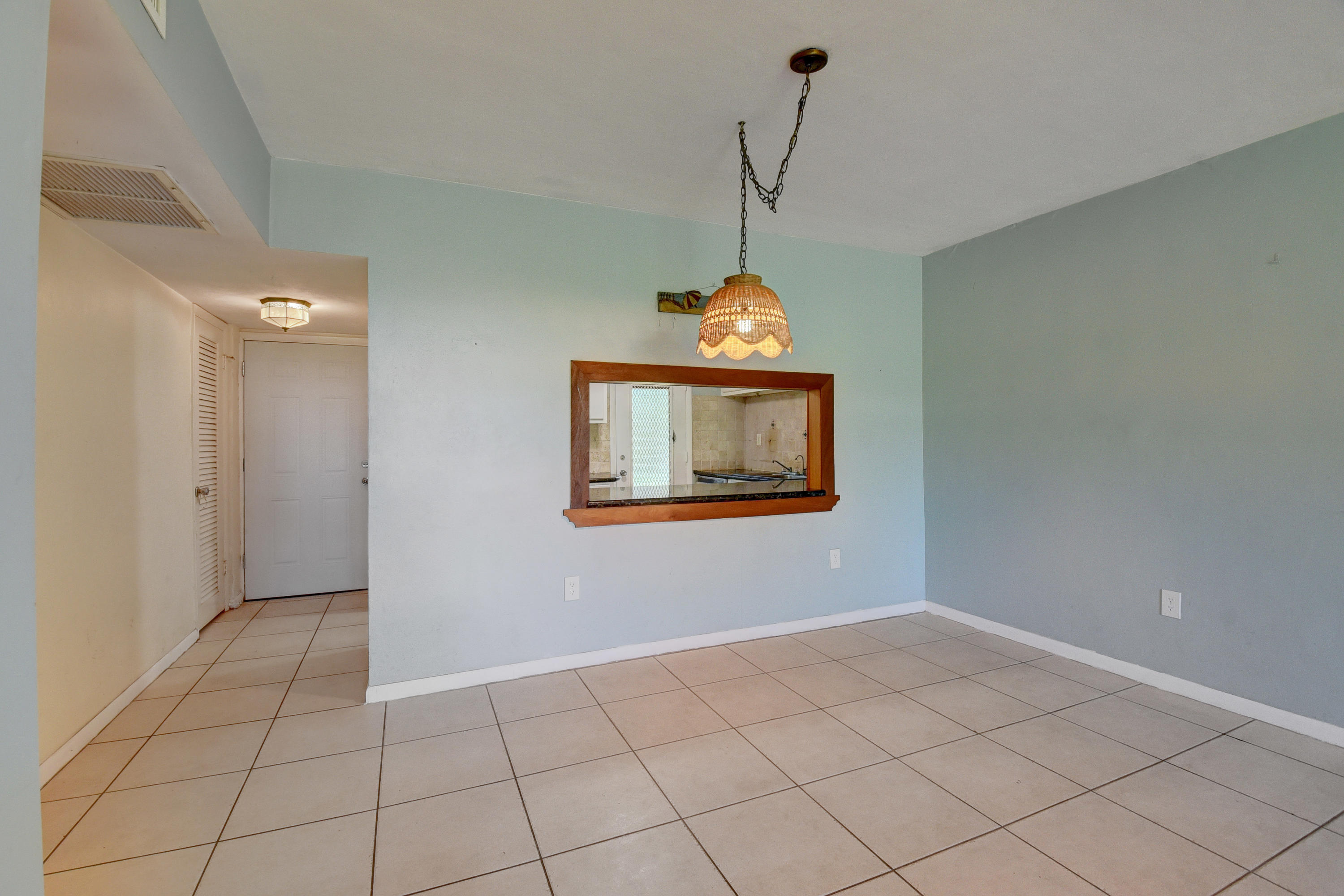 2700 Banyan Road, Unit 2C Boca Raton, FL 33432 - Photo 17 of 33 a view of an empty room with a window