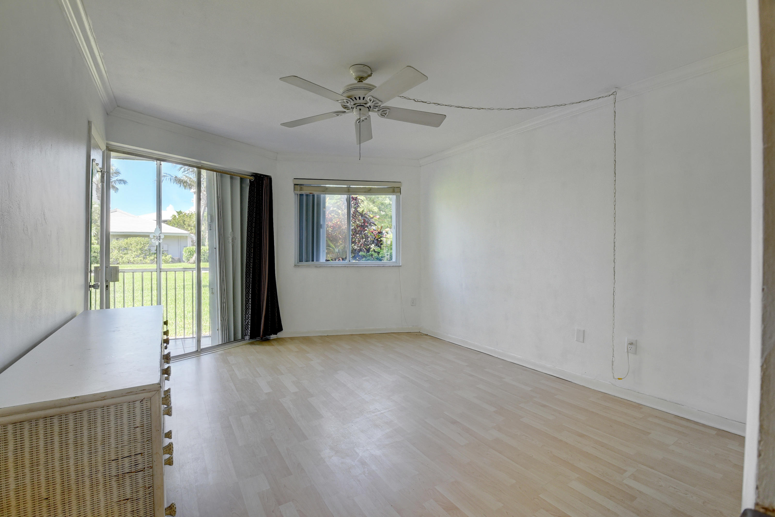 2700 Banyan Road, Unit 2C Boca Raton, FL 33432 - Photo 24 of 33 wooden floor in an empty room with a window
