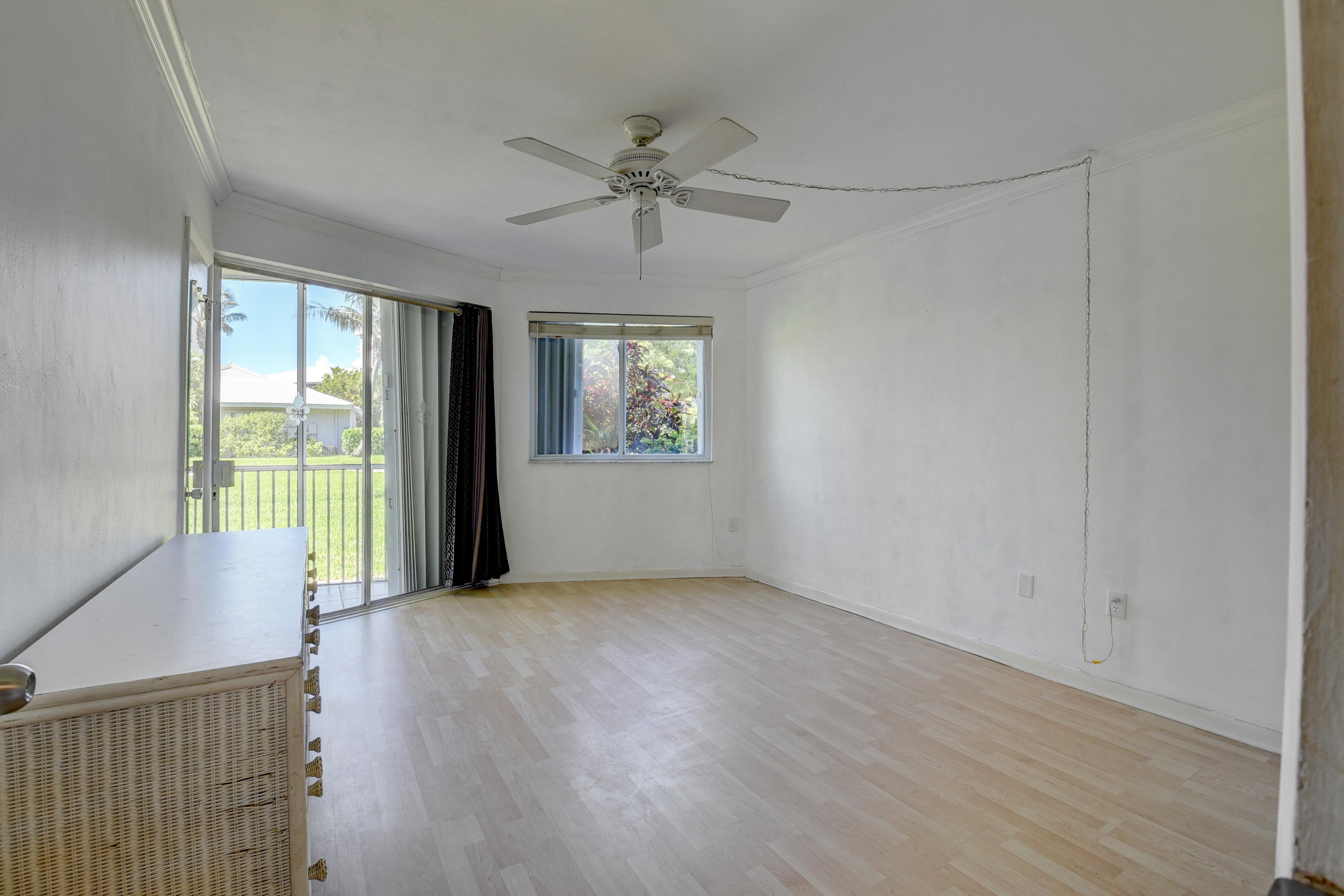 2700 Banyan Road, Unit 2C Boca Raton, FL 33432 - Photo 26 of 33 a view of an empty room with a window