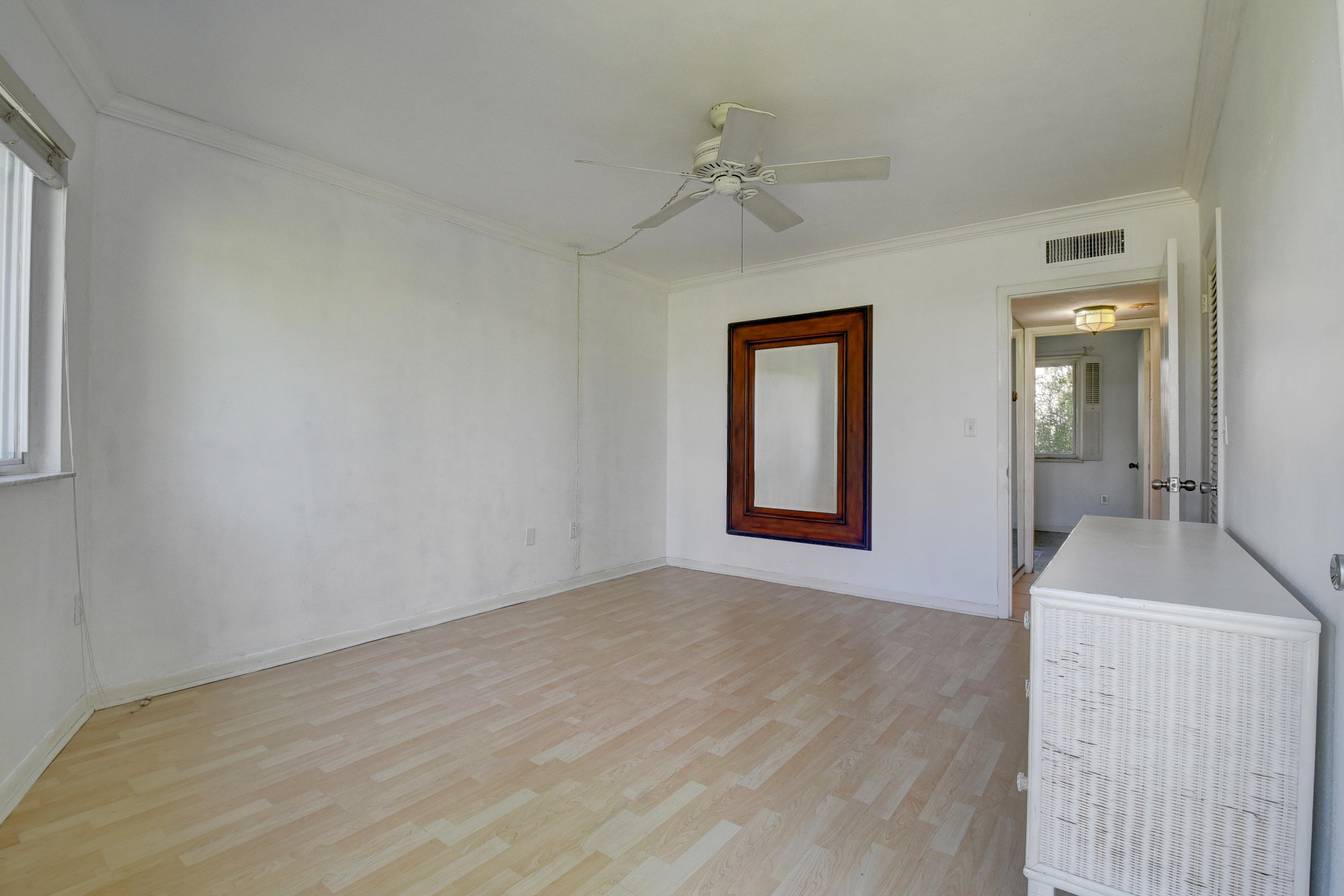 2700 Banyan Road, Unit 2C Boca Raton, FL 33432 - Photo 27 of 33 a view of an empty room with bathroom and a mirror