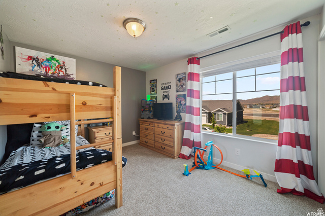 1836 Red Oak Road Eagle Mountain, UT 84005 - Photo 15 of 15 Bedroom with light carpet and baseboards