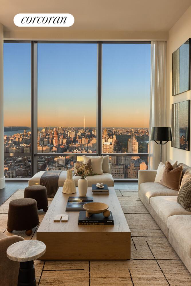 50 West 66th Street, Unit 41W Manhattan, NY 10023 - Photo 11 of 69 a living room with furniture and a large window