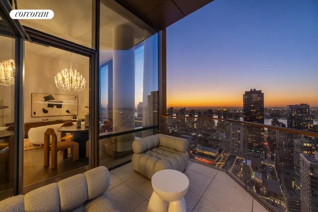 a living room with furniture a lamp and a large window