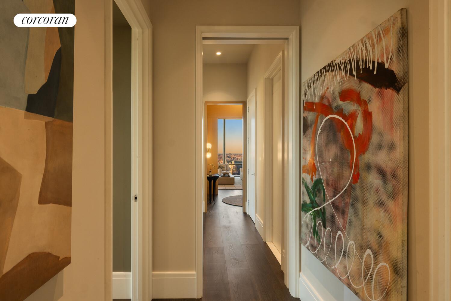 50 West 66th Street, Unit 41W Manhattan, NY 10023 - Photo 21 of 69 a view of a hallway with wooden floor and glass door