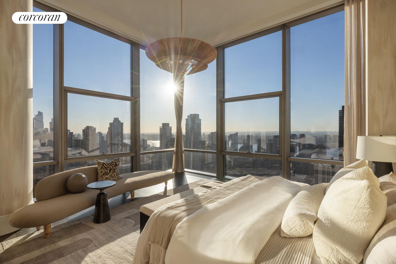 50 West 66th Street, Unit 41W Manhattan, NY 10023 - Photo 23 of 69 a bedroom with furniture and a large window