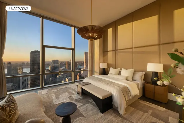 a lobby with furniture and a rug