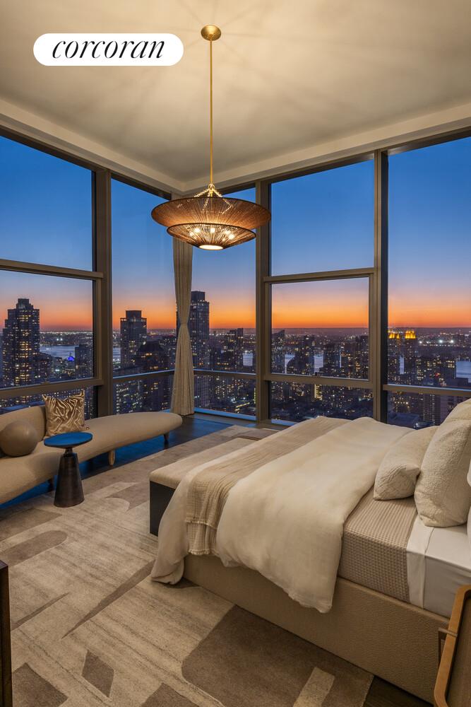 50 West 66th Street, Unit 41W Manhattan, NY 10023 - Photo 26 of 69 a room with furniture and a floor to ceiling window