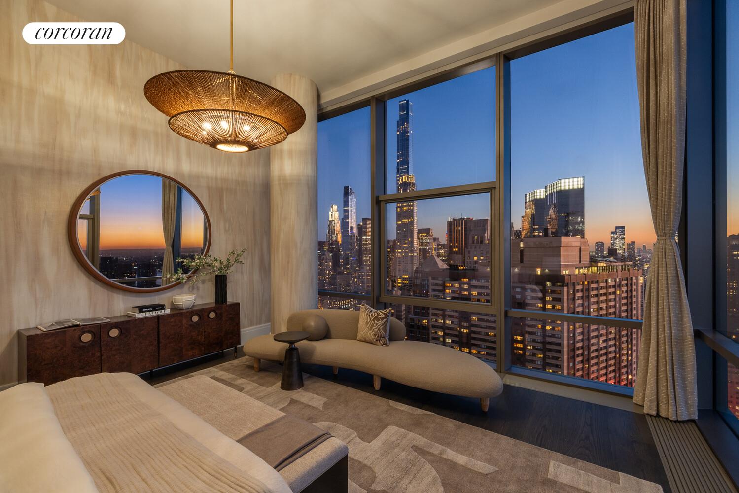 50 West 66th Street, Unit 41W Manhattan, NY 10023 - Photo 27 of 69 a living room with furniture a lamp and a large window