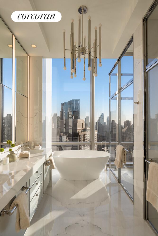 50 West 66th Street, Unit 41W Manhattan, NY 10023 - Photo 30 of 69 a view of a lobby with furniture and floor to ceiling window