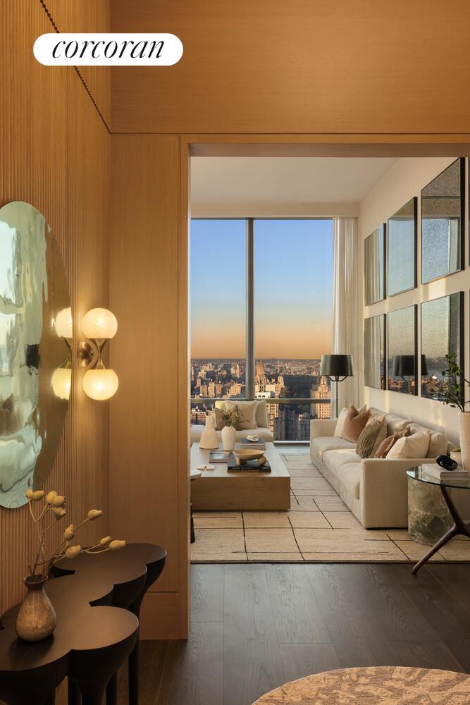 50 West 66th Street, Unit 41W Manhattan, NY 10023 - Photo 5 of 69 a living room with furniture and a table