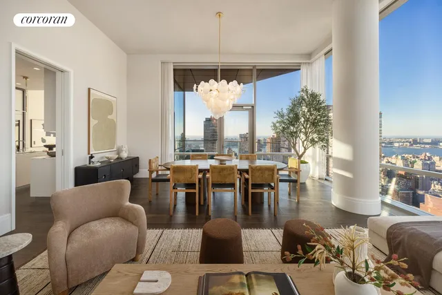 a view of a living room with a table and chair