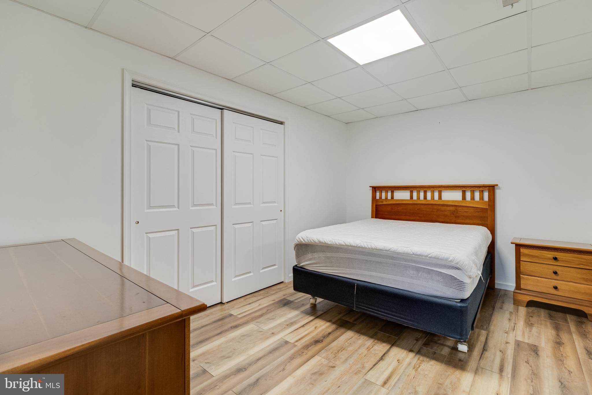 12015 Woodbury Road Nanjemoy, MD 20662 - Photo 39 of 53 a bedroom with a bed and a night stand