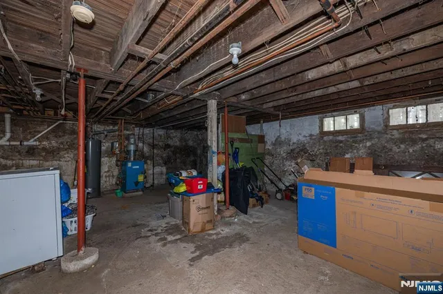 a living room with furniture and a mirror
