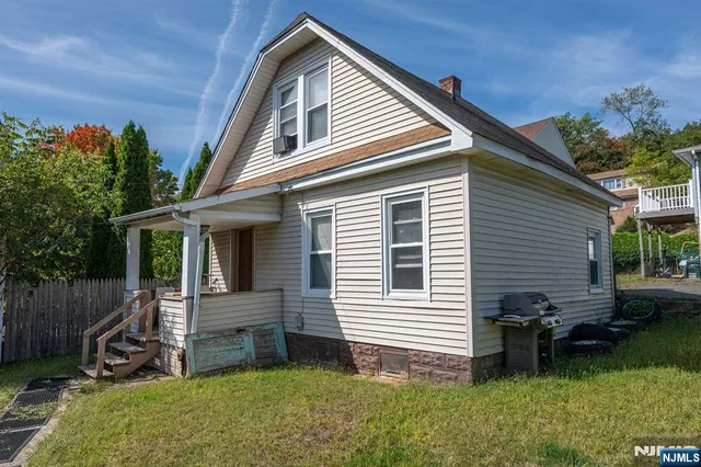 a bedroom with a bed and a television