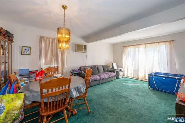 a bedroom with a bed closet and a desk