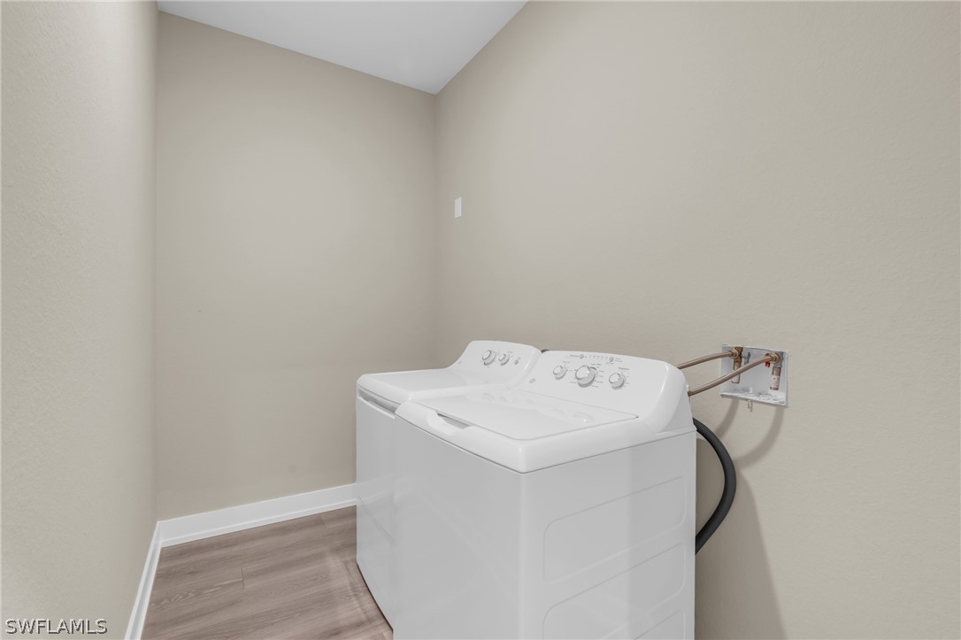 12208 Tetzel Avenue Port Charlotte, FL 33981 - Photo 20 of 45 a utility room with dryer and washer