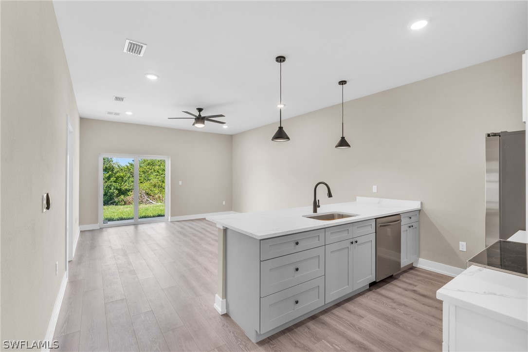 12208 Tetzel Avenue Port Charlotte, FL 33981 - Photo 23 of 45 a hallway with a sink and a window