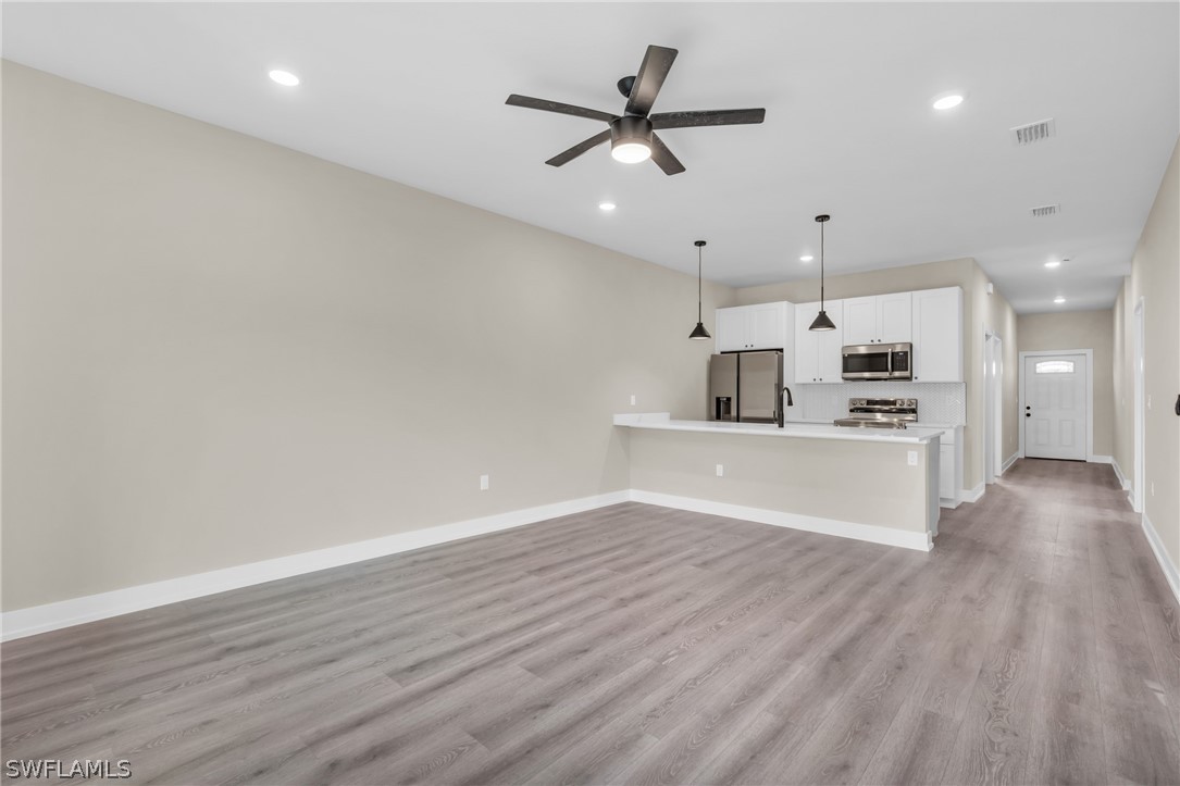 12208 Tetzel Avenue Port Charlotte, FL 33981 - Photo 24 of 45 a view of a kitchen with a dishwasher and a stove top oven