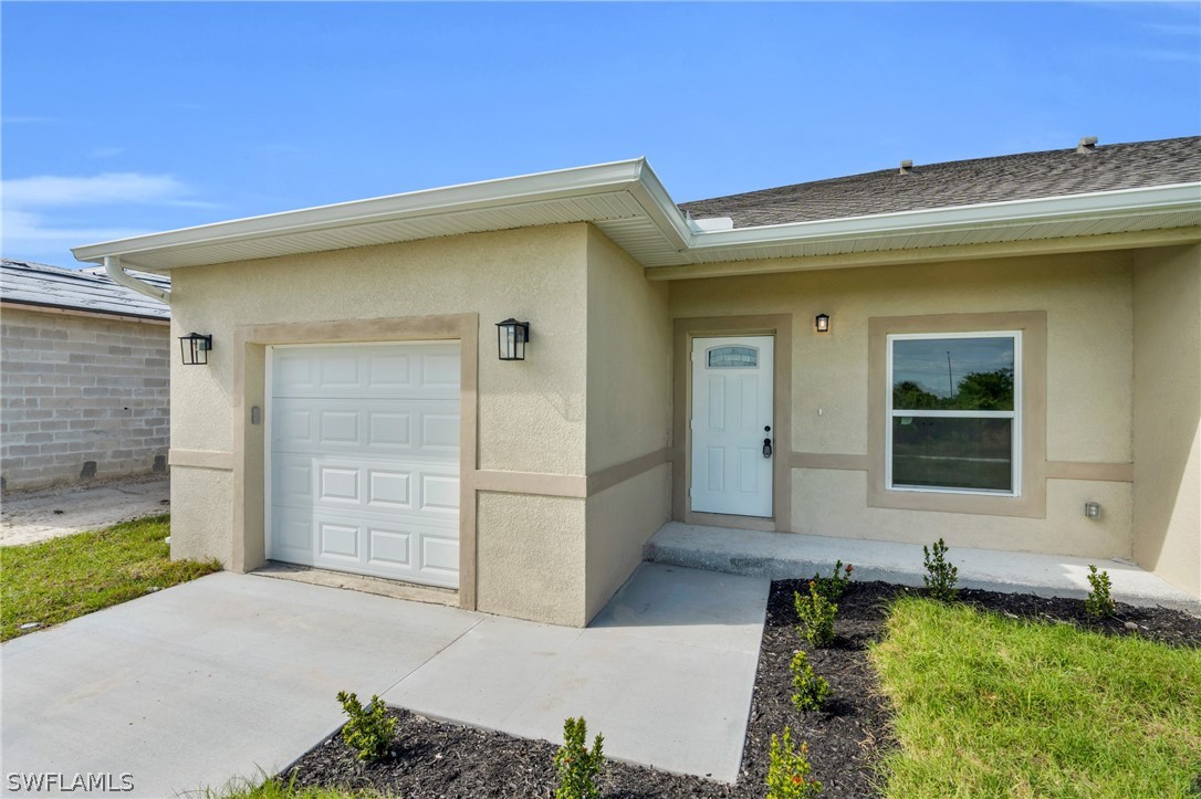 12208 Tetzel Avenue Port Charlotte, FL 33981 - Photo 35 of 45 a front view of a house with a yard