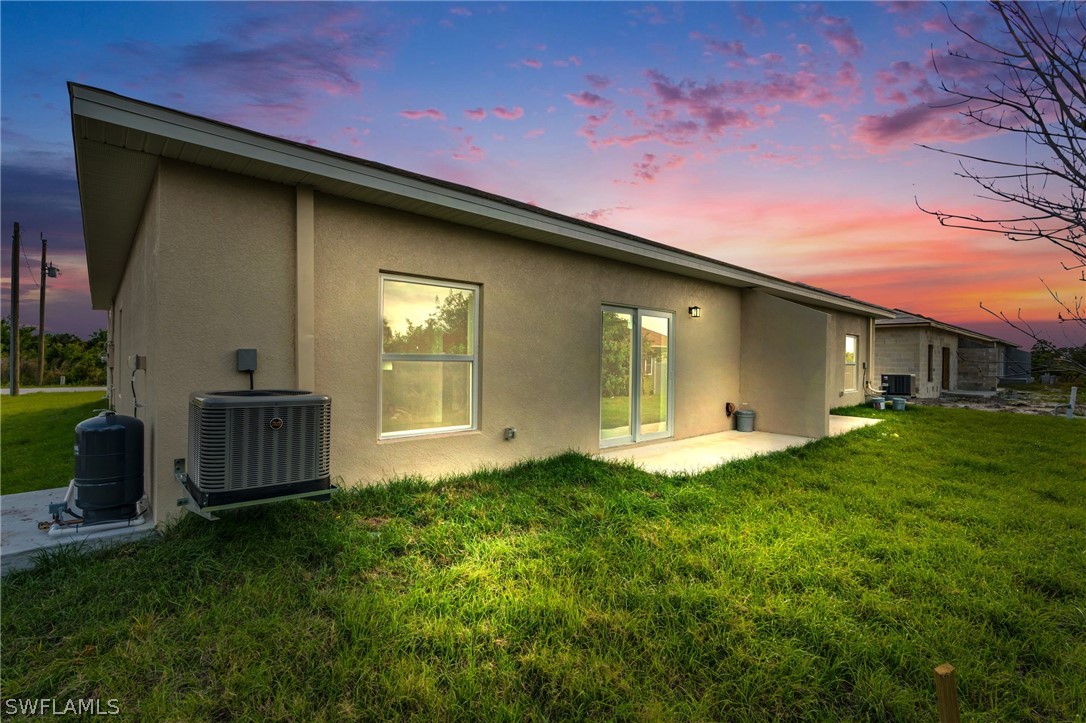 12208 Tetzel Avenue Port Charlotte, FL 33981 - Photo 45 of 45 a front view of a house with garden