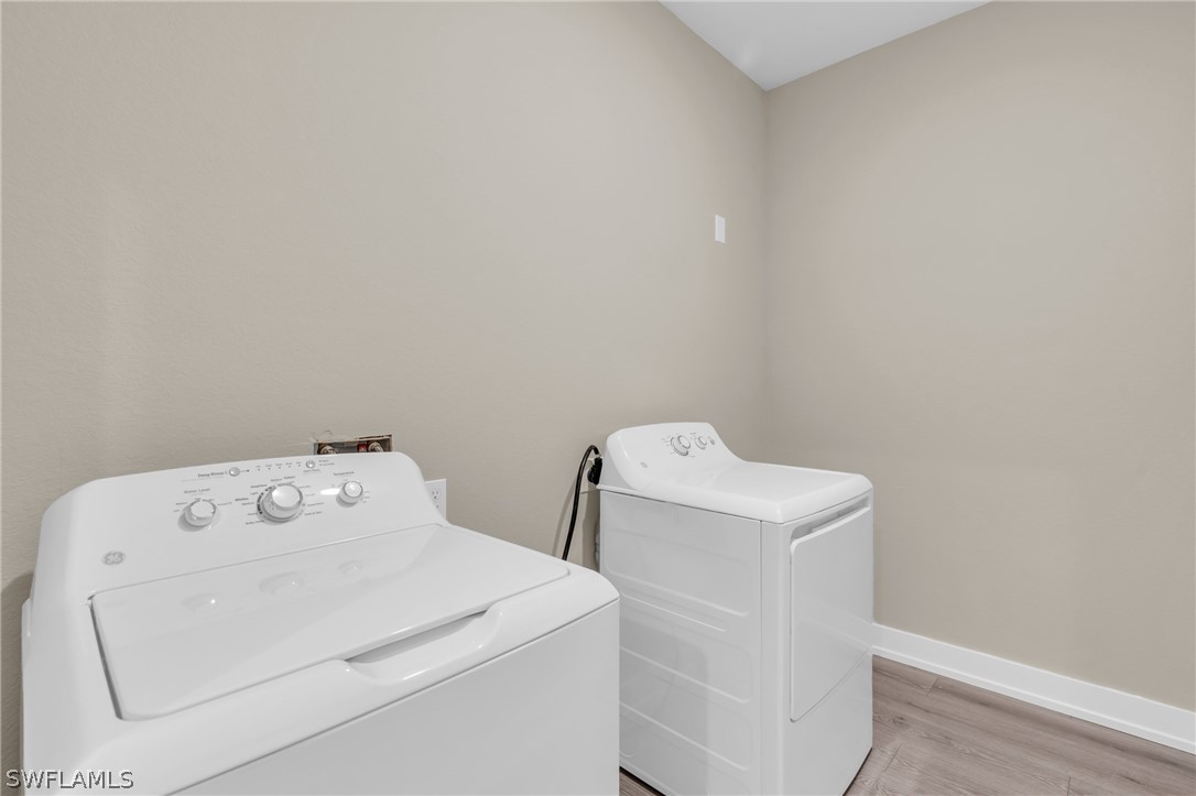 12208 Tetzel Avenue Port Charlotte, FL 33981 - Photo 8 of 45 a utility room with dryer and washer