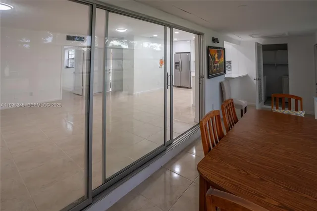 a view of a hallway with wooden shelves