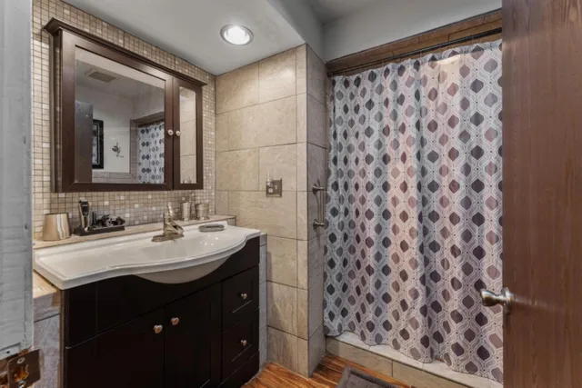 a livingroom with workspace couch and a window