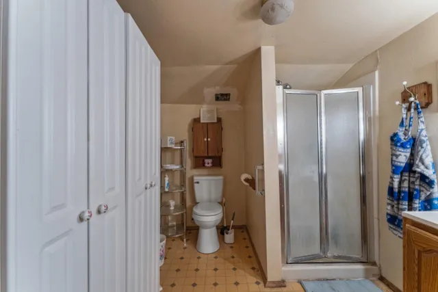 an aerial view of a house with a garden and swimming pool
