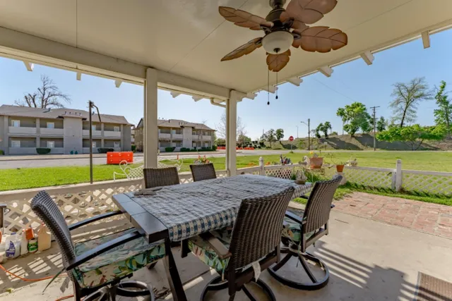 an aerial view of a house with swimming pool and outdoor space