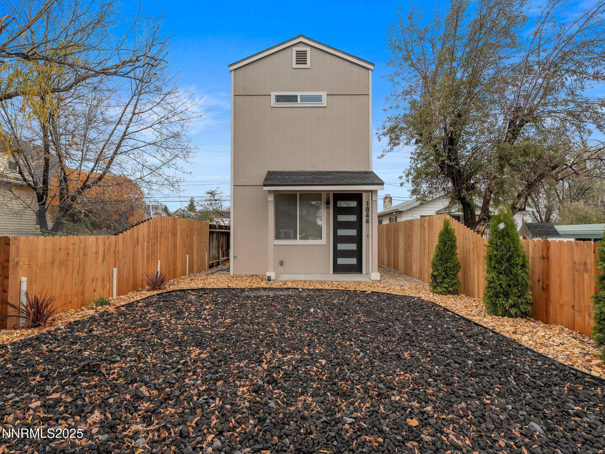 1844 H Street, Unit 1 Sparks, NV 89431 - Photo 1 of 14 a front view of a house with a yard