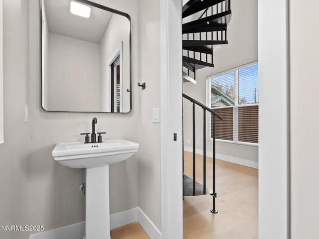 a bathroom with a sink a mirror and shower