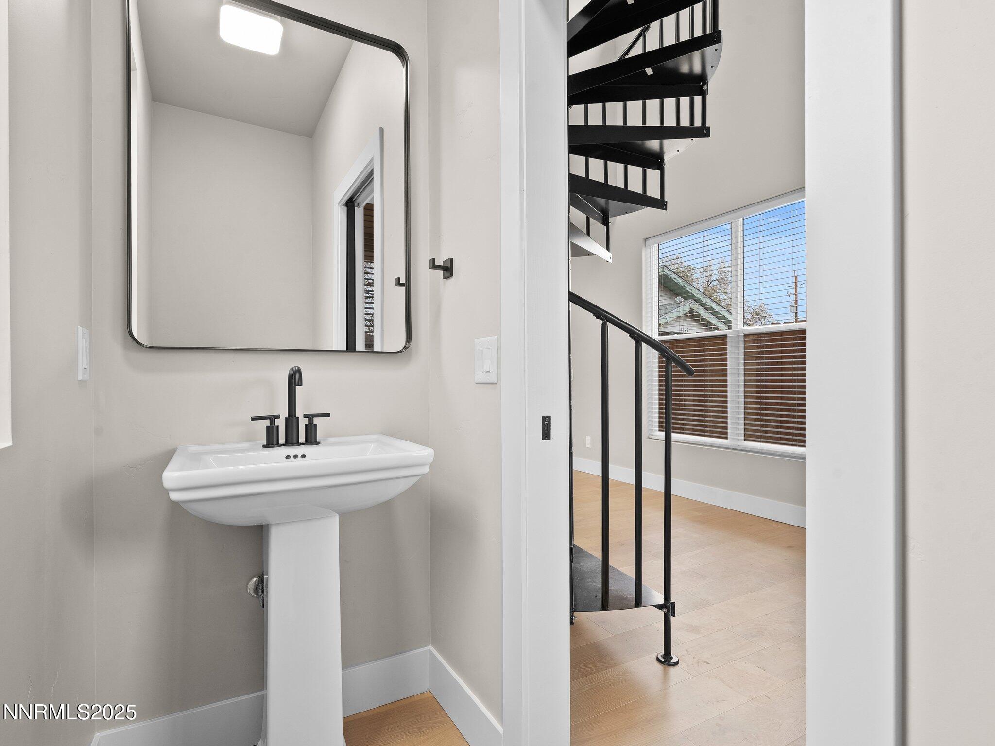 1844 H Street, Unit 1 Sparks, NV 89431 - Photo 8 of 14 a bathroom with a sink a mirror and shower