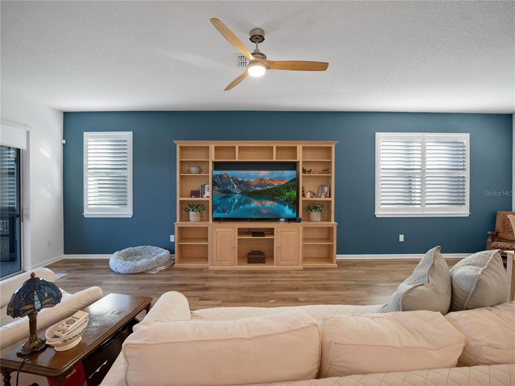 8741 Southwest 61st Loop Ocala, FL 34481 - Photo 12 of 60 a living room with furniture and a window