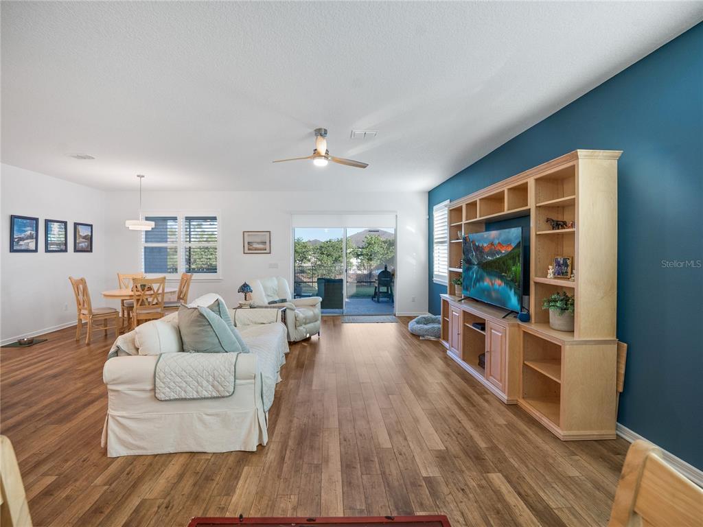8741 Southwest 61st Loop Ocala, FL 34481 - Photo 15 of 60 a living room with furniture and a flat screen tv