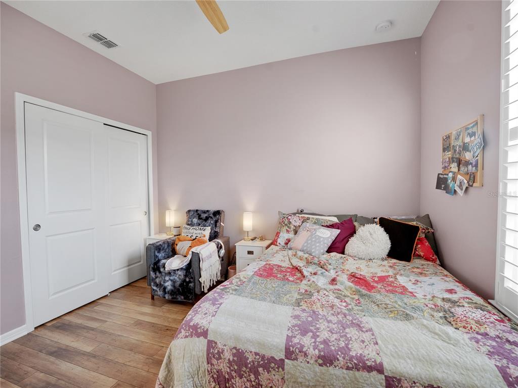 8741 Southwest 61st Loop Ocala, FL 34481 - Photo 23 of 60 a bed room with two beds and a couch