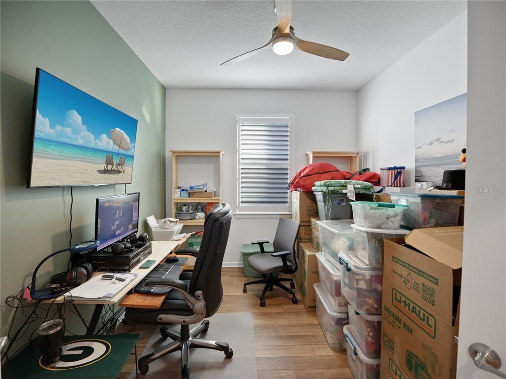 8741 Southwest 61st Loop Ocala, FL 34481 - Photo 26 of 60 a view of a workspace with furniture and a window