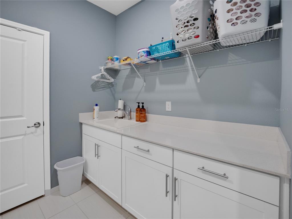 8741 Southwest 61st Loop Ocala, FL 34481 - Photo 32 of 60 a bathroom with a sink and a mirror